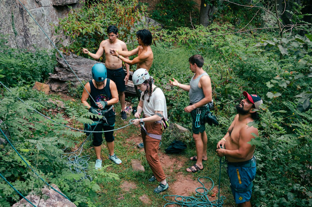 Small group learning photography outdoors with an instructor